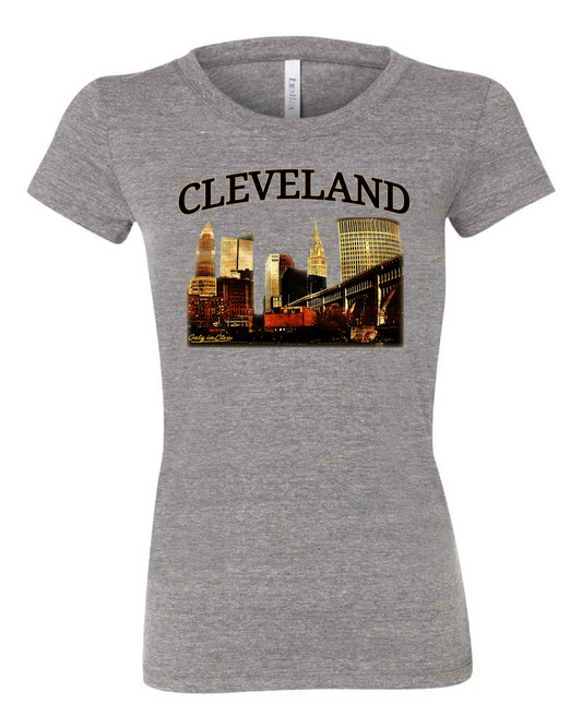 Grey women's t-shirt with 'CLEVELAND' text and a skyline graphic of Cleveland, Ohio.
