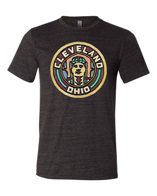 Black t-shirt with a colorful round design on the front that says "Cleveland Ohio" and shows a stylized face from the Guardian of Traffic statue.