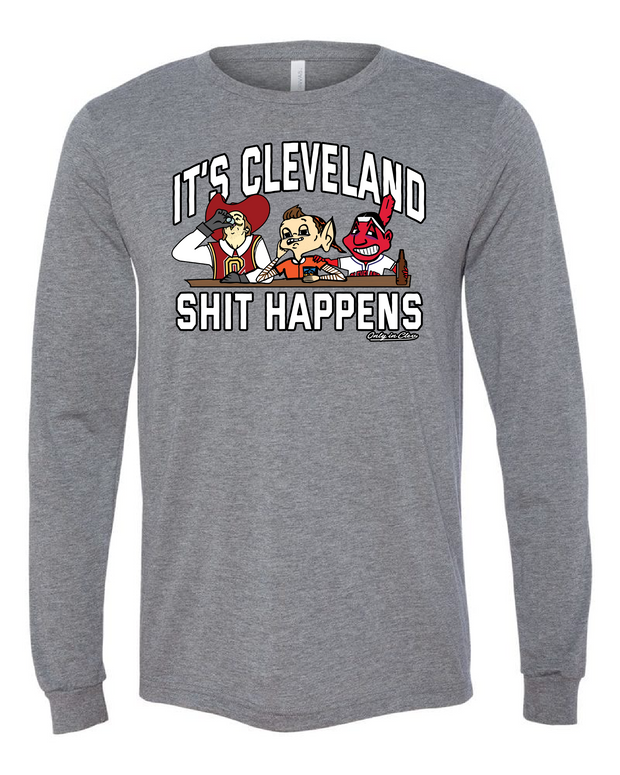 A grey longsleeve with the text 'IT'S CLEVELAND SHIT HAPPENS' on the front, featuring cartoonish sports characters.