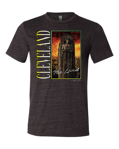 Black t-shirt with 'CLEVELAND' and 'THE LAND' text on the front and a graphic of a sports stadium on the back.